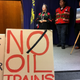 Activists appear at a news conference in Oregon March 13, 2017, where state regulations on oil trains were being announced. Photo: AP